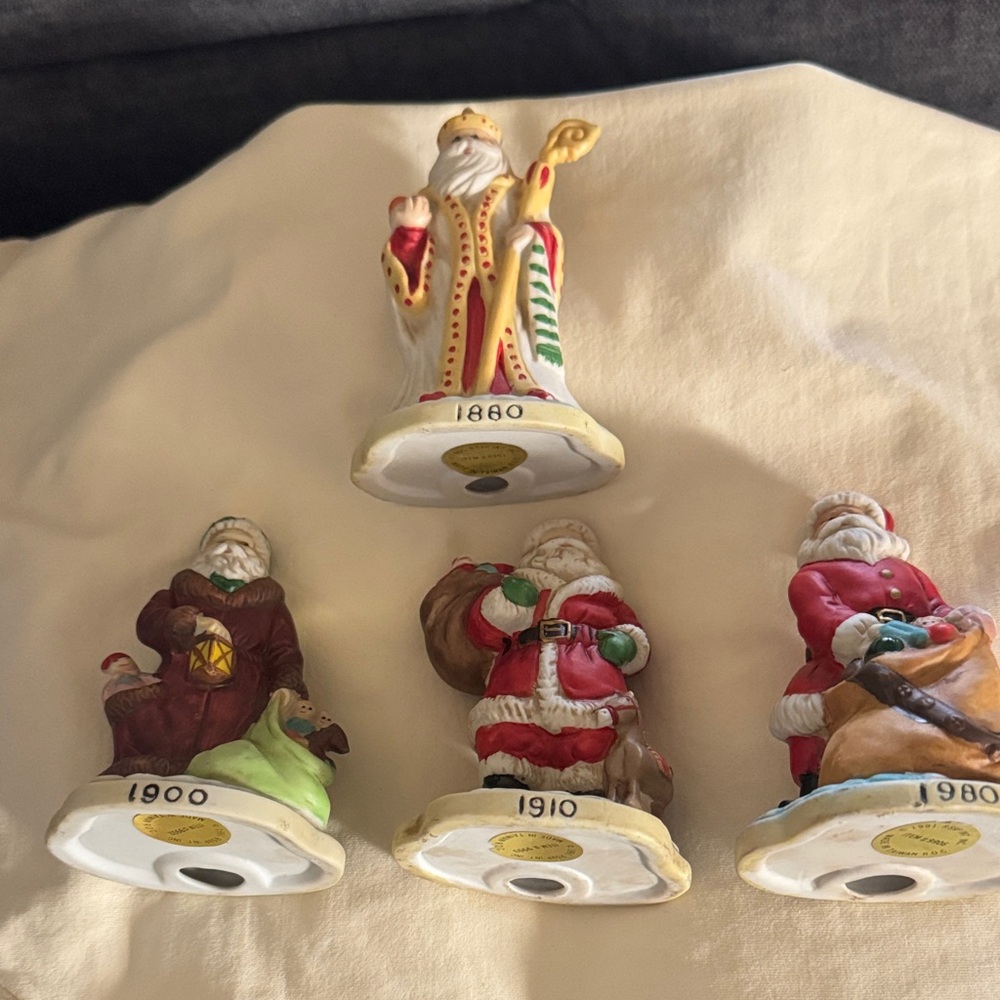 4 Santa Claus Figurine Set - Multicolor 1880, 1900, 1910, & 1980 no chips